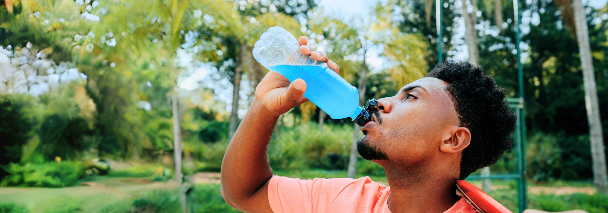 African_American_Man_playing_beach_tennis_Drink