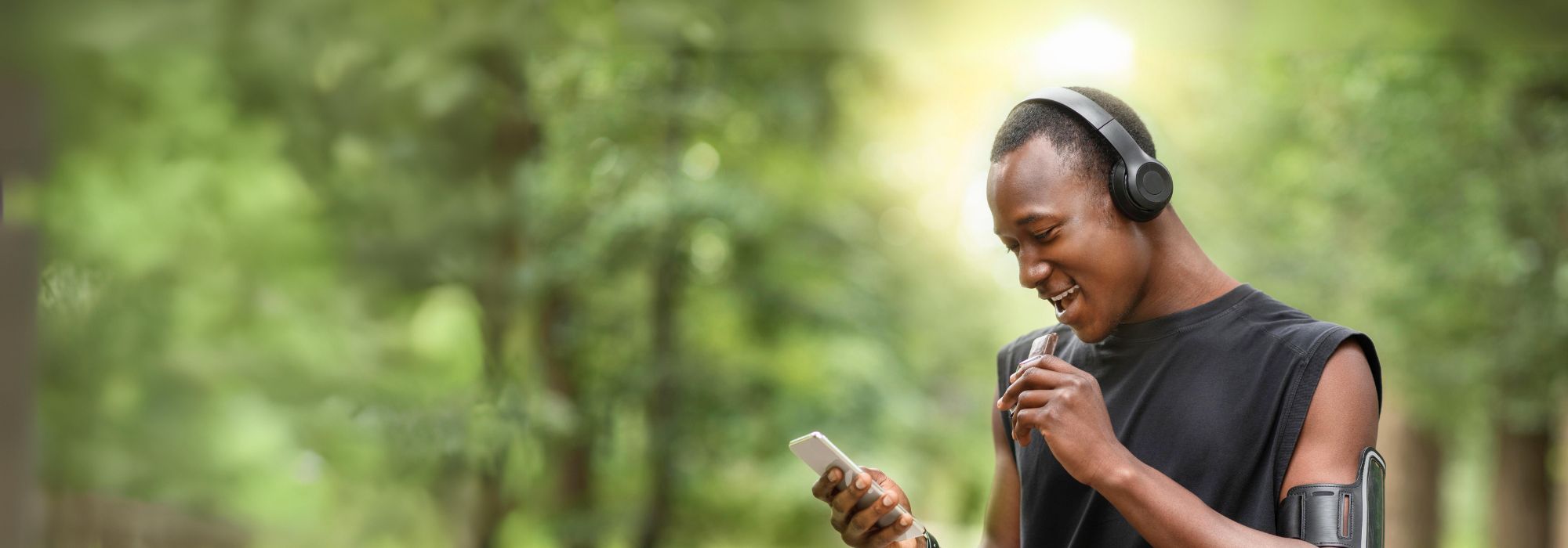 African Man Eating Energy Bar Running