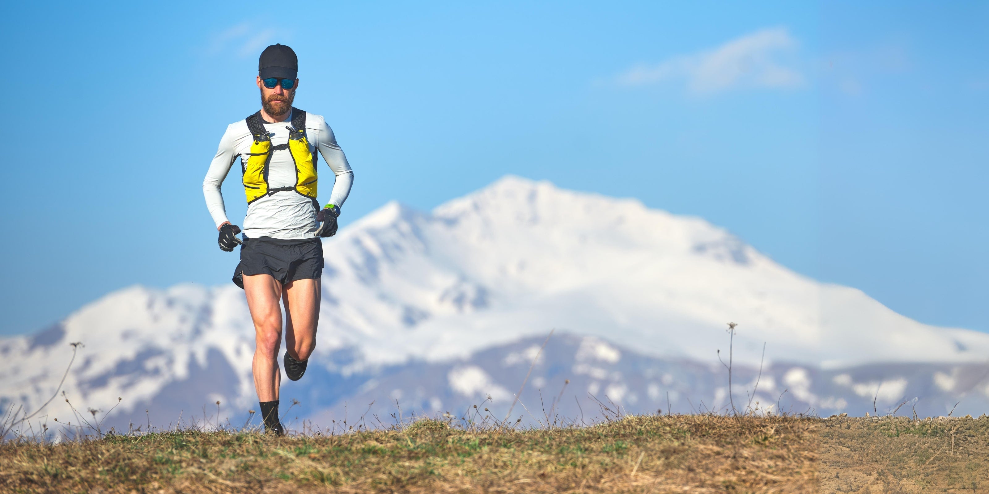 Man Running Triathlon Mountain Energy Drink Chews Gels Protein Bar