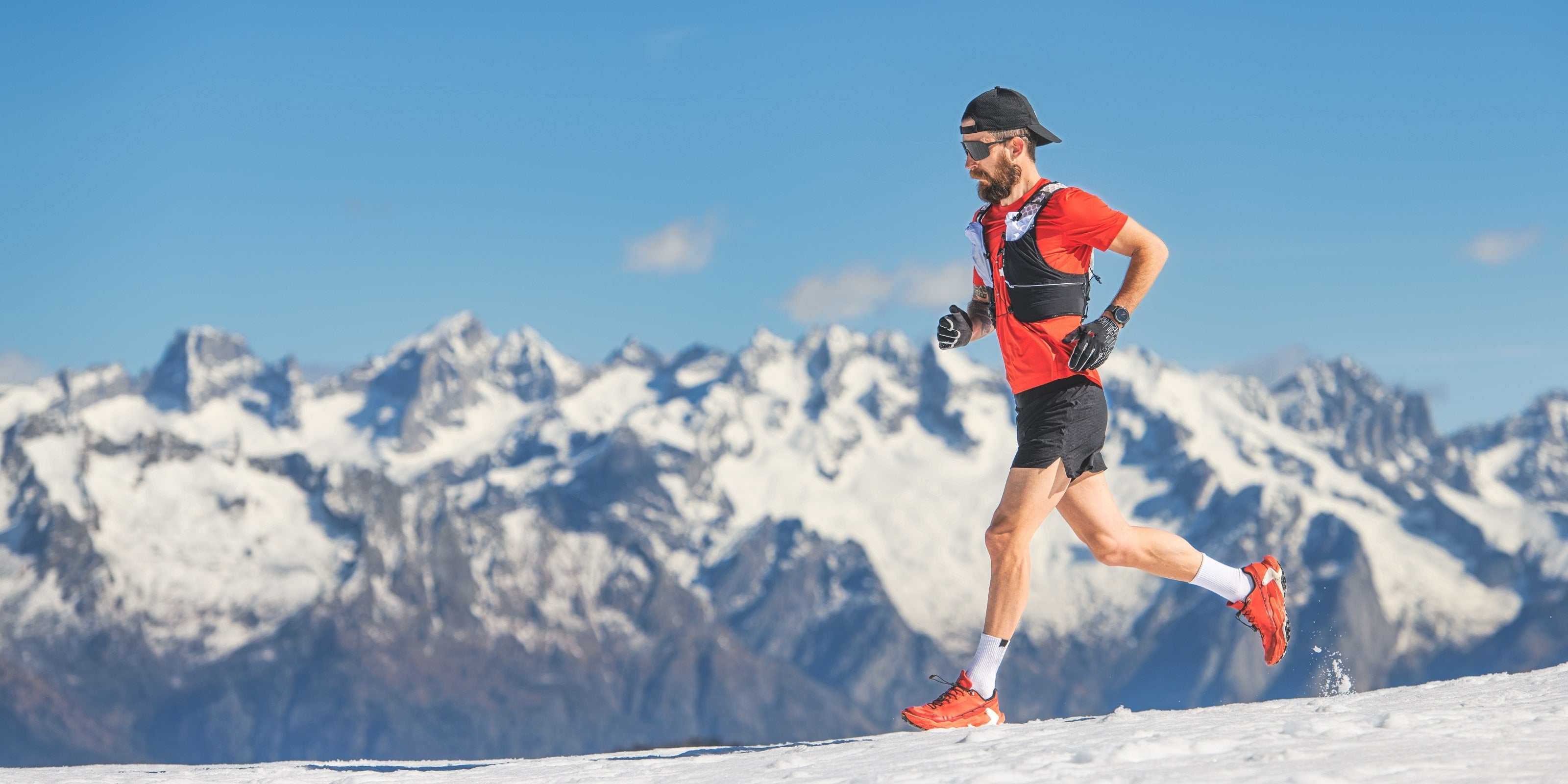 Man Running Triathlon Mountain Snow Energy Drink Chews Gels Protein Bar
